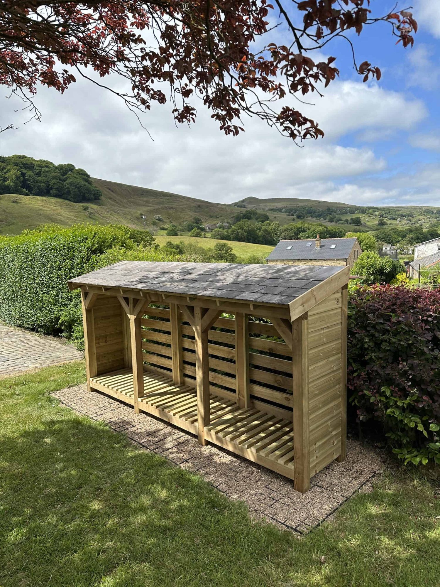 Handmade Bertie slate roof log store with reclaimed Welsh slate roof