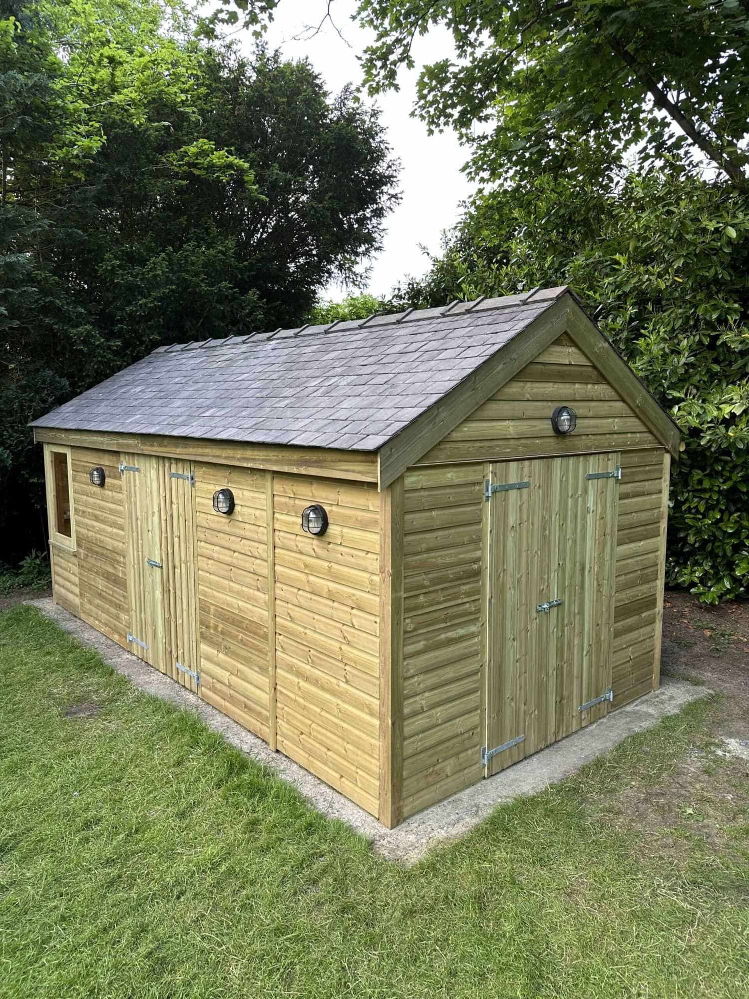 Large timber garden storage shed with reclaimed slate roof built in the UK