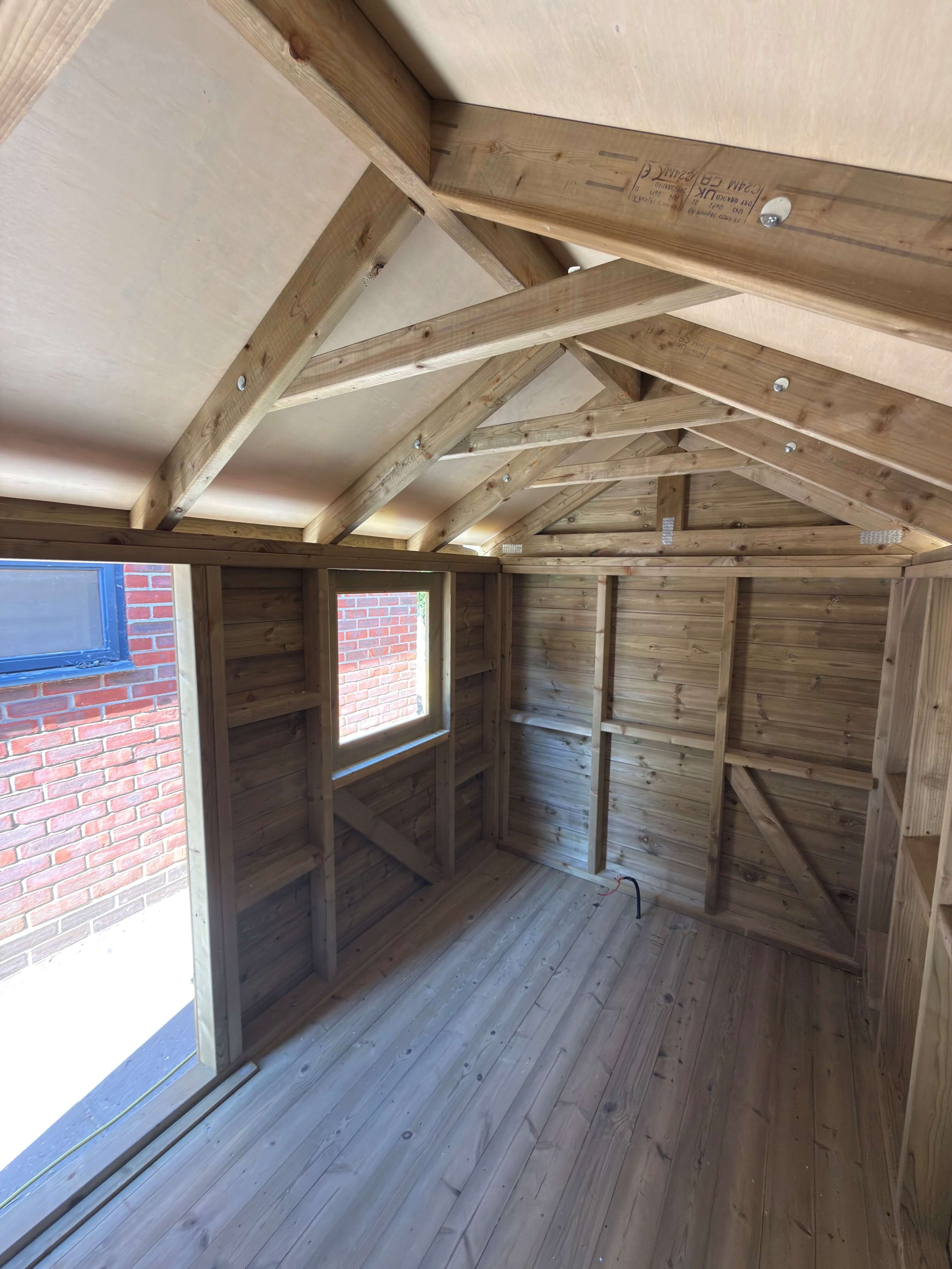 Interior timber framework and roof construction of Permitted Development Shed