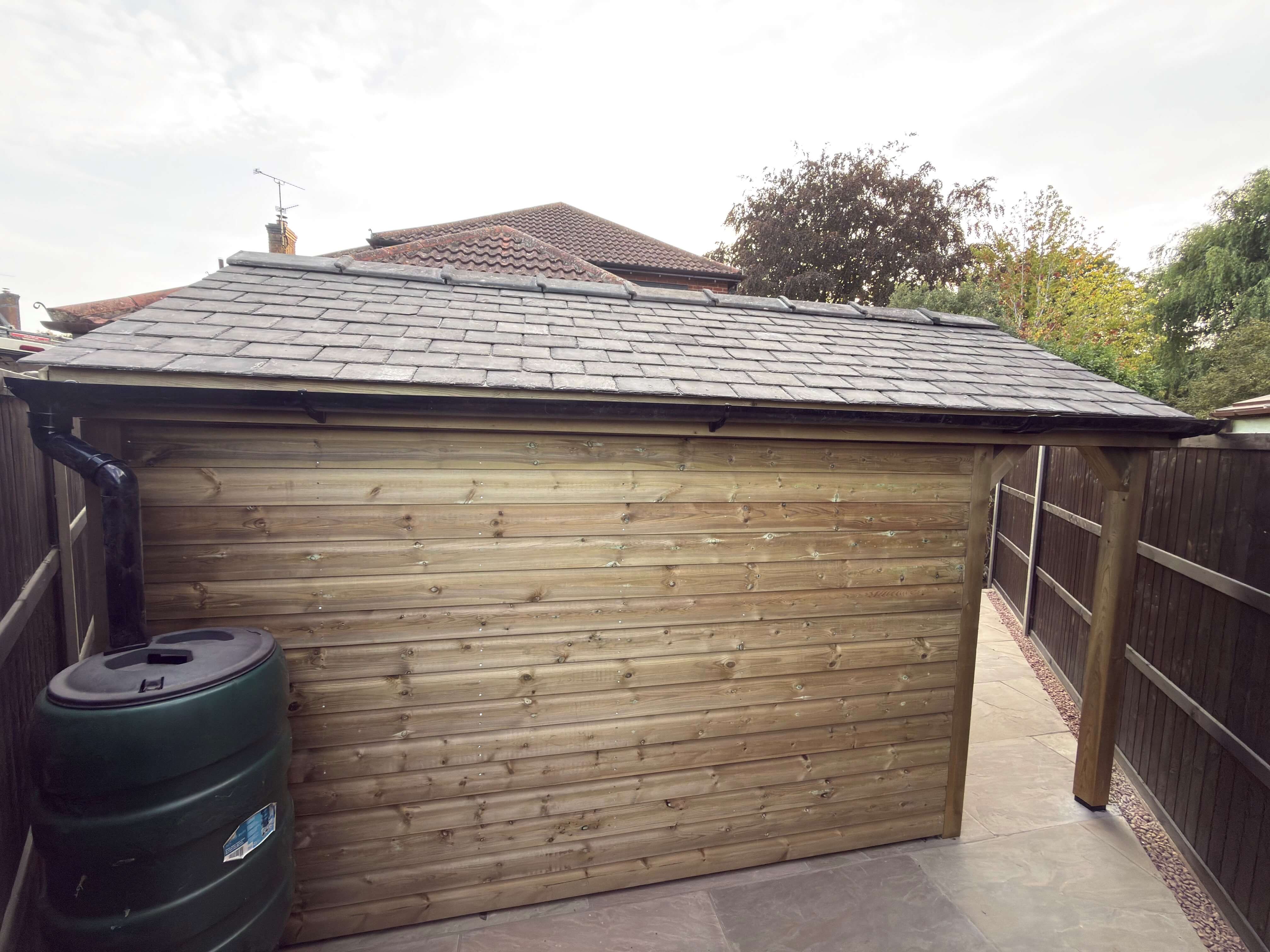 Rear elevation of handmade timber shed with reclaimed Welsh slate roof
