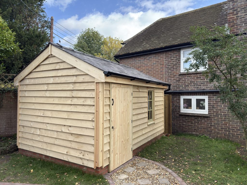 Weatherboard Workshop Shed with reclaimed slate roof, featherboard cladding, timber door and window